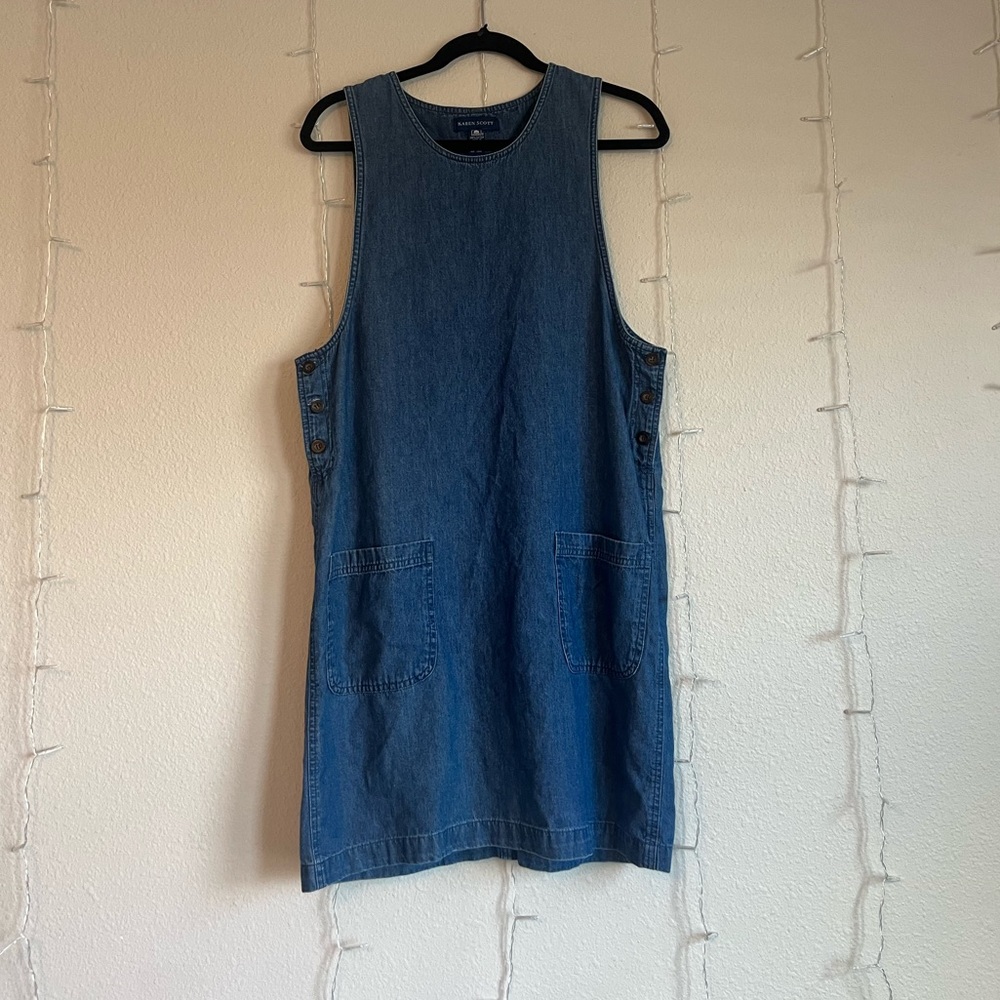 an adorable denim dress with pockets and buttons